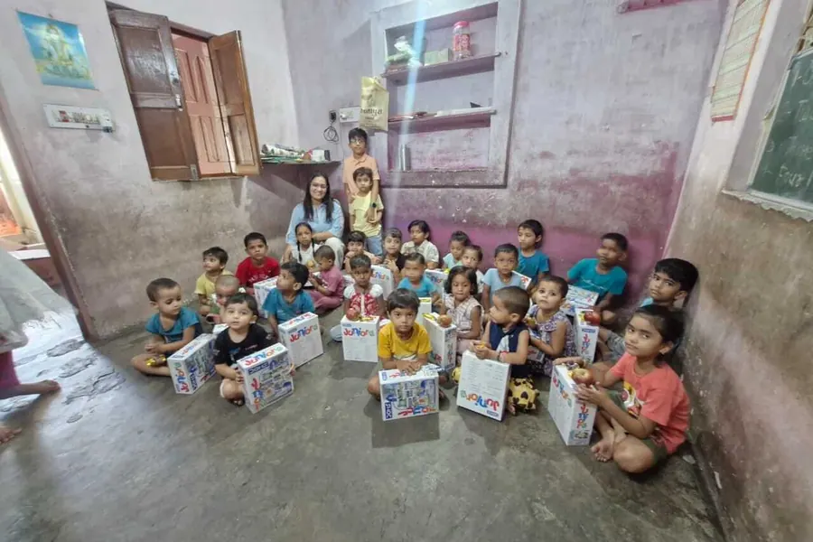 Children outside the centre with the kits handed out to them