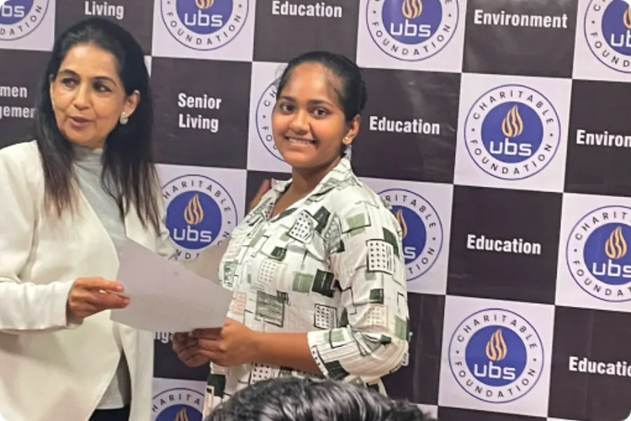 A scholar receiving her award letter