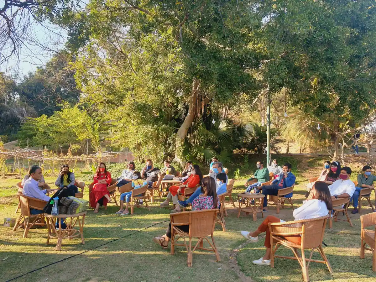 A conservation talk under the trees at the farm